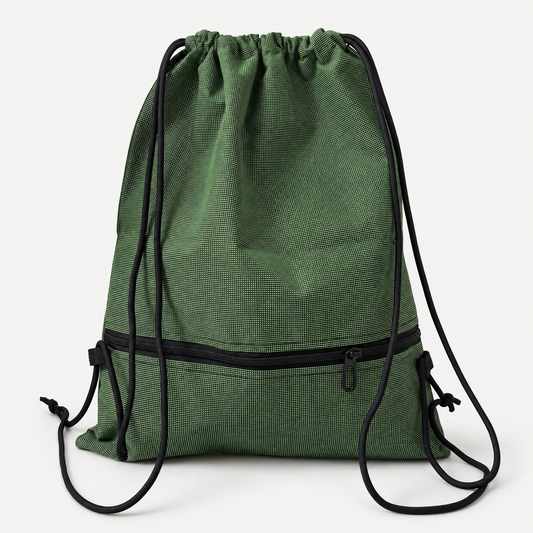 CoreFold Drawstring Backpack on a warm light-grey studio background